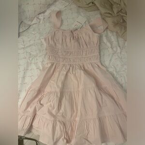 Selling a new aritzia martine mini dress. Color- shy pink, size-small.